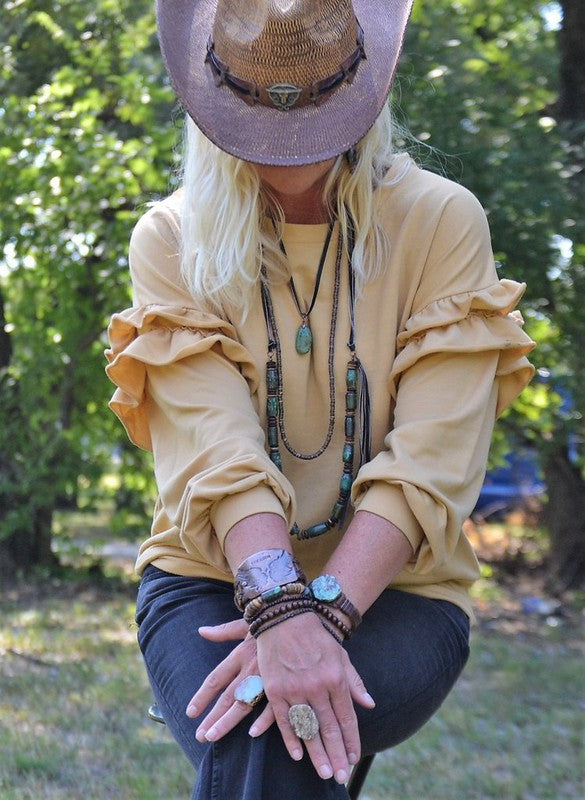 Turquoise pendant necklace with a leather cord, adjustable self-tie closure, and unique pendant size ranging from 1 to 2 inches.