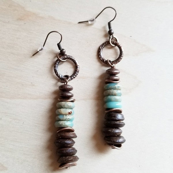 Handcrafted earrings featuring Aqua Terra stones, warm wood beads, and sleek metal accents.