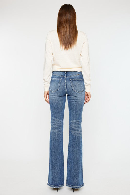 Medium stone wash high-rise flare jeans with pockets, a button closure, and a long length silhouette.