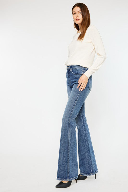 Medium stone wash high-rise flare jeans with pockets, a button closure, and a long length silhouette.