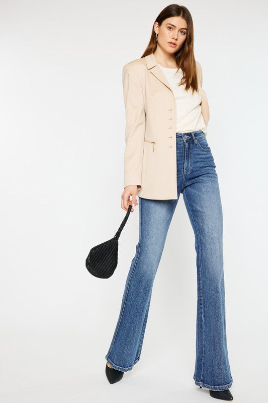 Medium stone wash high-rise flare jeans with pockets, a button closure, and a long length silhouette.