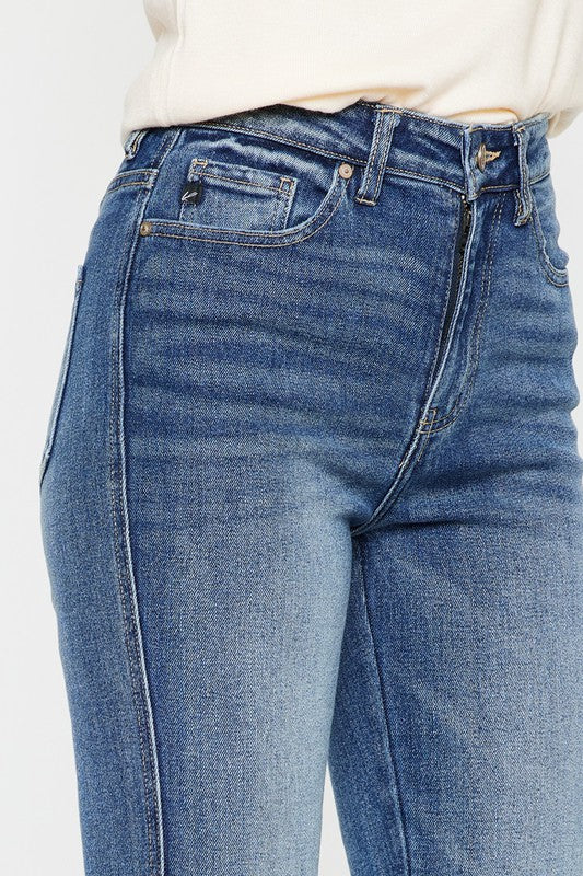 Medium stone wash high-rise flare jeans with pockets, a button closure, and a long length silhouette.