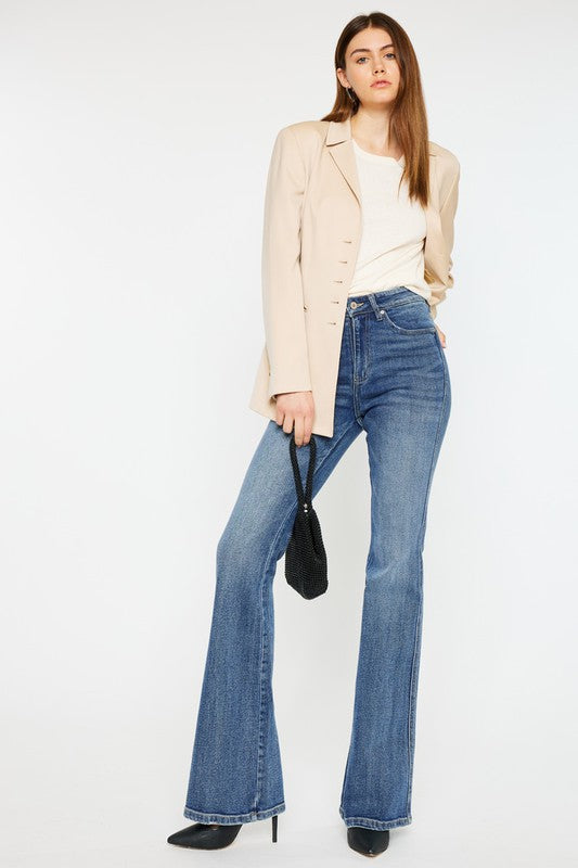 Medium stone wash high-rise flare jeans with pockets, a button closure, and a long length silhouette.