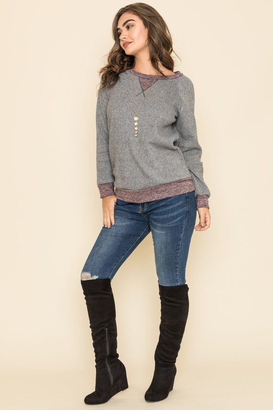 Casual charcoal tunic with long raglan sleeves, round neck, and two-tone design.