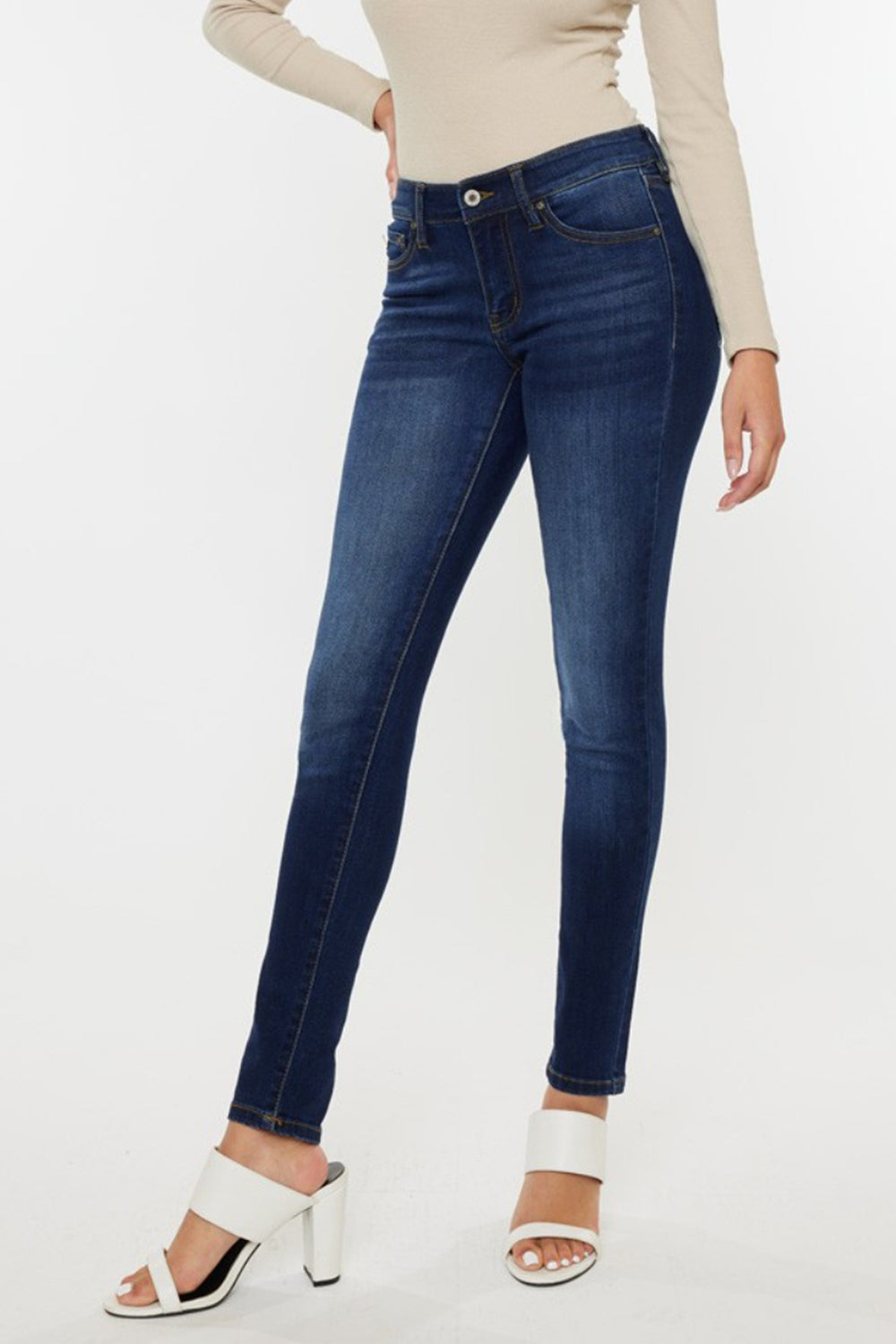 Mid rise gradient skinny jeans with a dark wash. Slightly stretchy, with pockets and a zip fly closure.