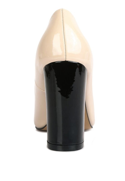 Back view of nude Kamira Patent Pumps with high block heel.