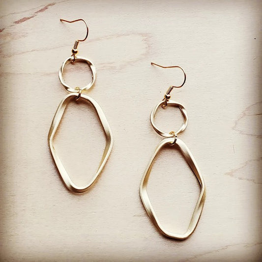 Matte gold hoop earrings with an oval hoop design, approximately 4" in length.