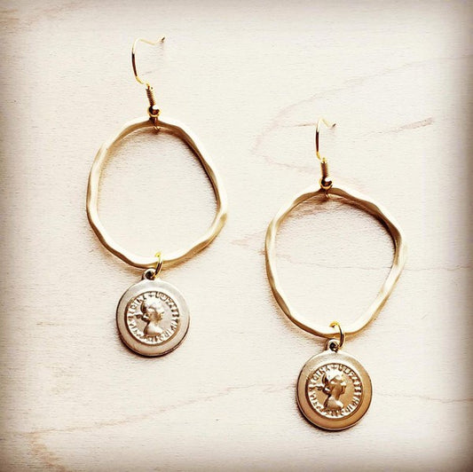 Matte gold hoop earrings with a coin-shaped dangle for a chic boho look, approximately 4" in length.