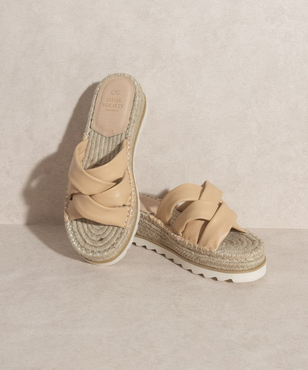 Nude, strappy, slip-on sandal with a 2.25" platform.