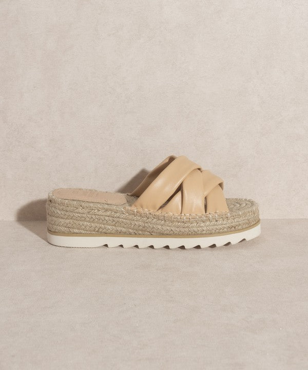 Nude, strappy, slip-on sandal with a 2.25" platform.