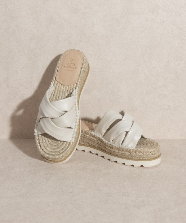 Off white, strappy, slip-on sandal with a 2.25" platform.