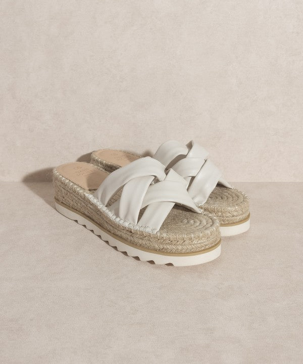 Off white, strappy, slip-on sandal with a 2.25" platform.