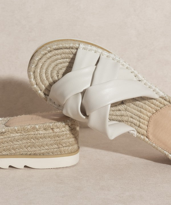 Off white, strappy, slip-on sandal with a 2.25" platform.