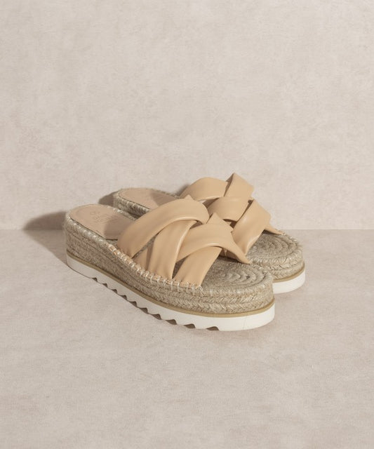 Nude, strappy, slip-on sandal with a 2.25" platform.