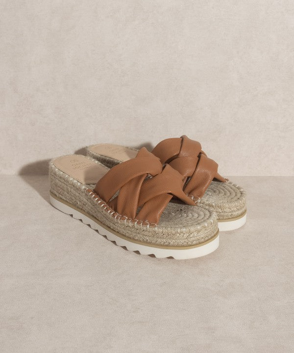 Brown, strappy, slip-on sandal with a 2.25" platform.