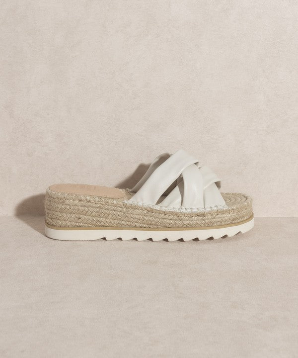 Off white, strappy, slip-on sandal with a 2.25" platform.