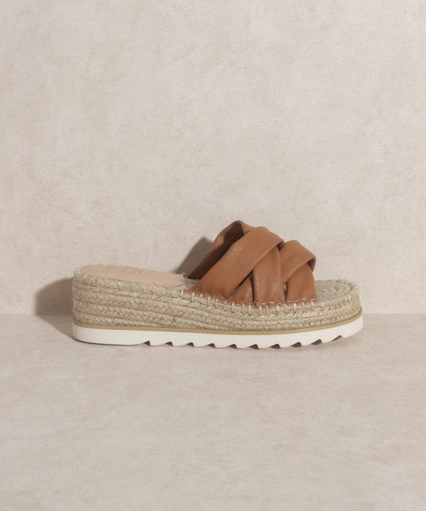 Brown, strappy, slip-on sandal with a 2.25" platform.