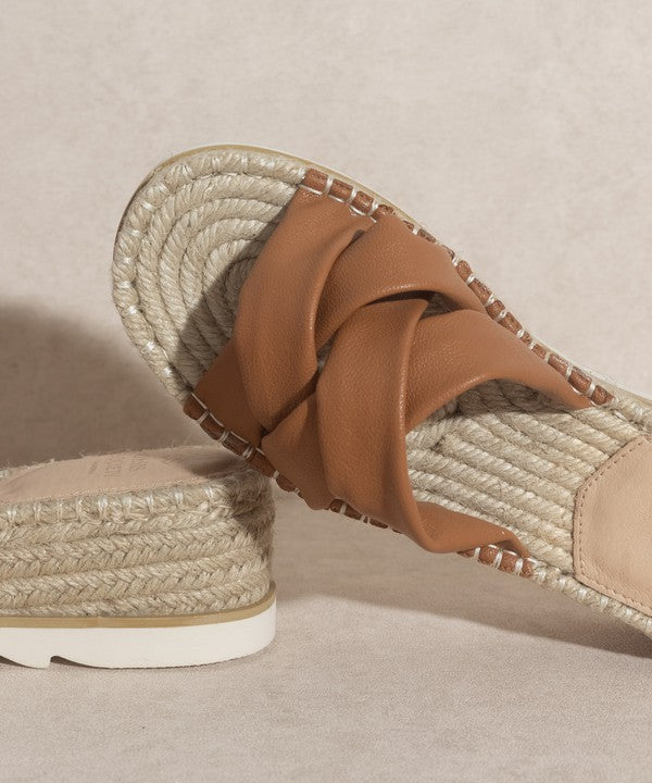 Brown, strappy, slip-on sandal with a 2.25" platform.