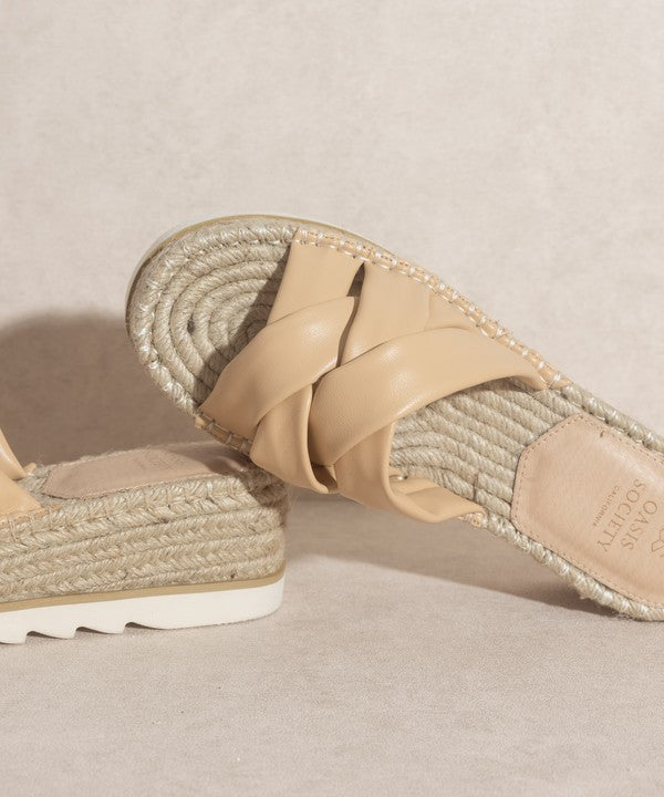 Nude, strappy, slip-on sandal with a 2.25" platform.