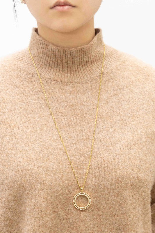 Gold tone necklace with a 2.25-inch pendant and a 31-inch chain length. Features a luxurious 24K gold-plated finish and a secure lobster clasp.