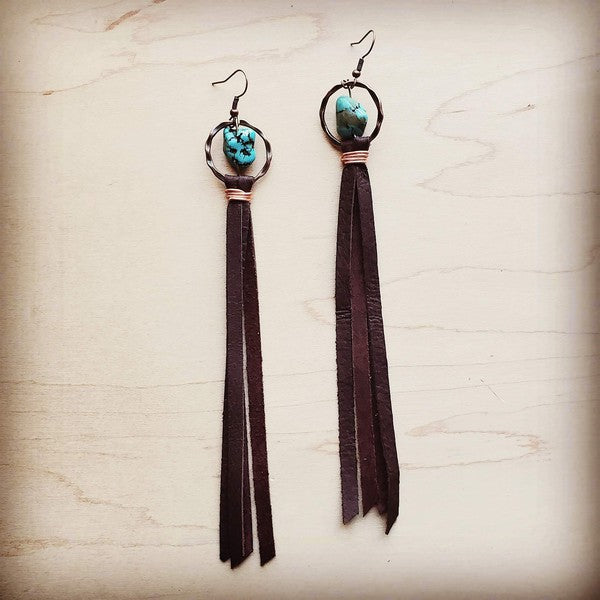 Turquoise earrings with leather tassels, 5" long.