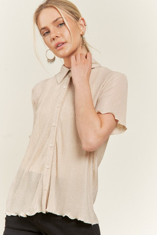 Model wearing taupe Tilda textured button down shirt, collared neck.