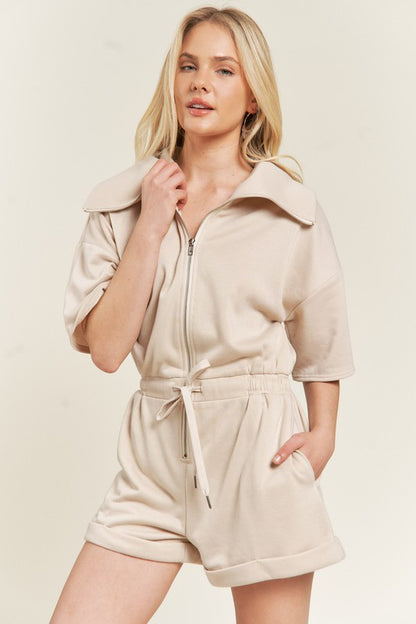 Beige Clover Plus Size romper showing French terry texture and drawstring waist.