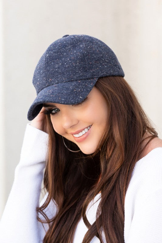 Woman wearing Faryn Fall Tweed Ball Cap in Navy showcasing vintage tweed fabric and structured crown