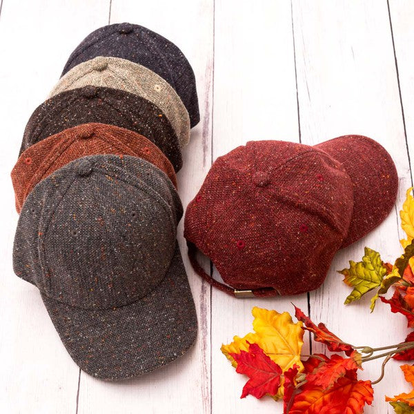 All color variants of the Faryn Fall Tweed Ball Cap displayed flat with cozy fall props
