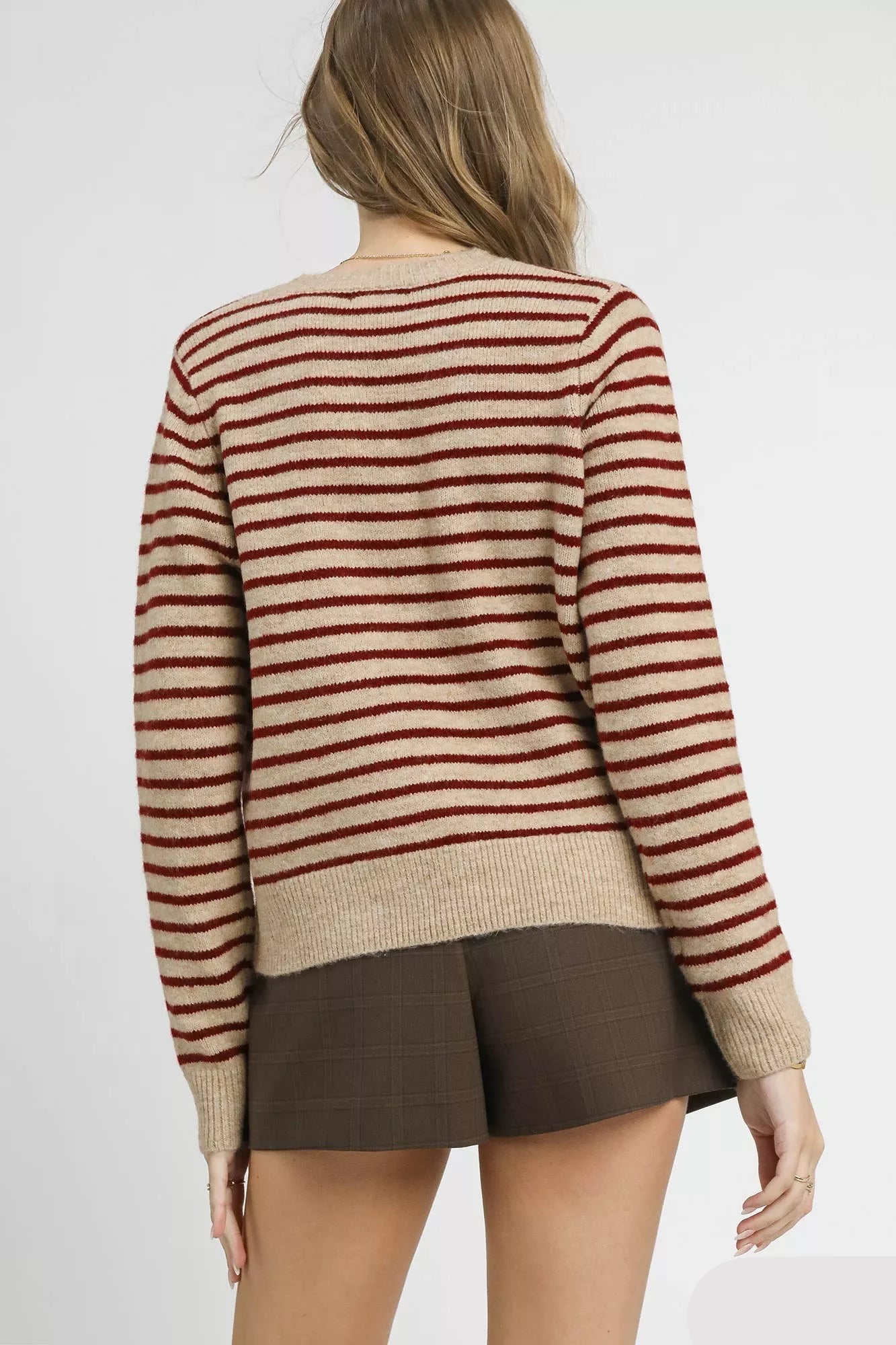 Magda knit cardigan in tan red stripes, back view with long sleeves.