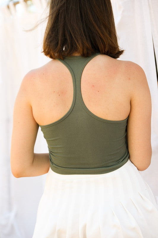 A ribbed racerback brami top in olive, sleeveless, cropped, and pullover style.