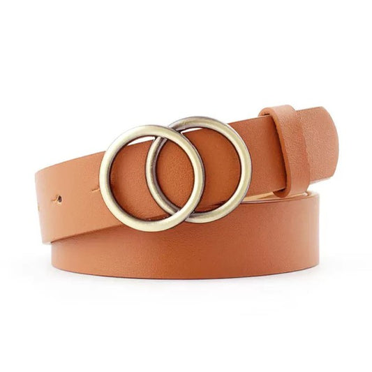 Flat lay of camel Double O-Ring Belt in vegan leather with bronze hardware.
