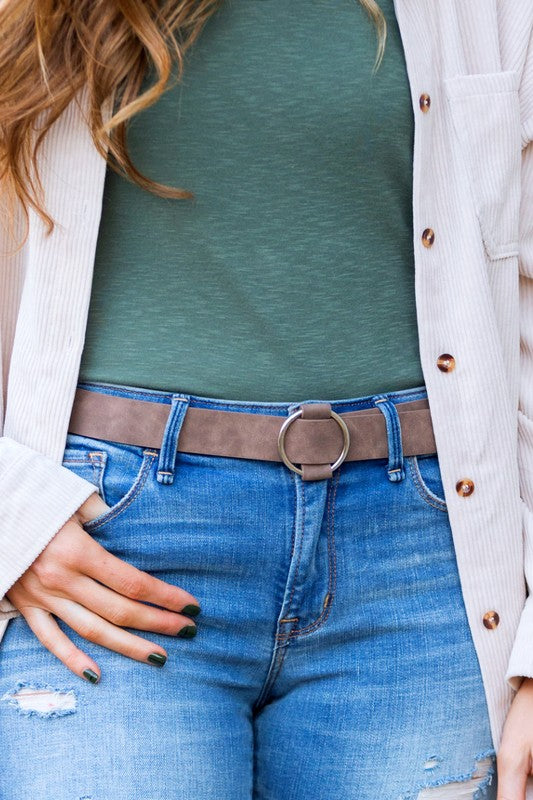 Taupe vegan leather belt with silver O-ring buckle.