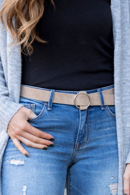 Cream vegan leather belt with silver O-ring buckle.