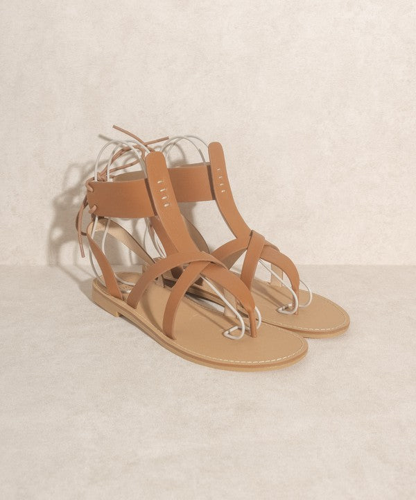 Brown boho-style lace-up ankle sandals.