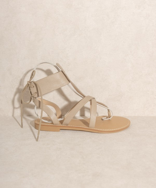 Taupe boho-style lace-up ankle sandals.