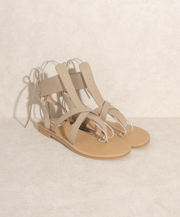 Taupe boho-style lace-up ankle sandals.