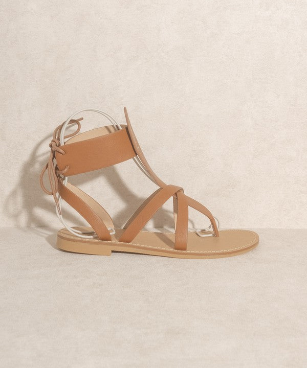 Brown boho-style lace-up ankle sandals.