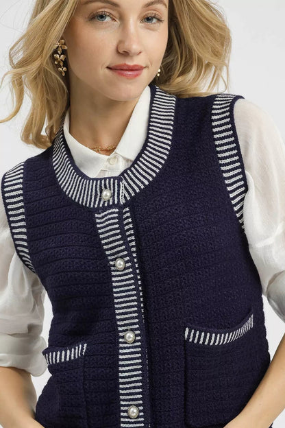 Close-up of Mirren Sweater Vest buttons and striped neckline detail for a classic finish.