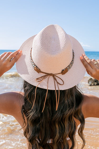 Back view of blush Panama Straw Fedora Hat showing wide brim and suede band accent.
