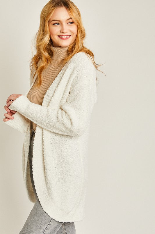 Ivory solid open-front long sweater cardigan with a V-neckline, long sleeves, and a loose fit.