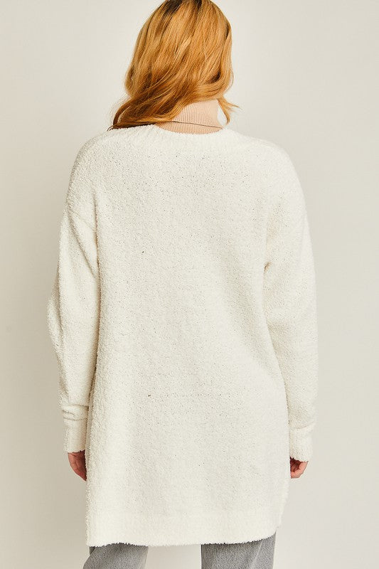 Ivory solid open-front long sweater cardigan with a V-neckline, long sleeves, and a loose fit.