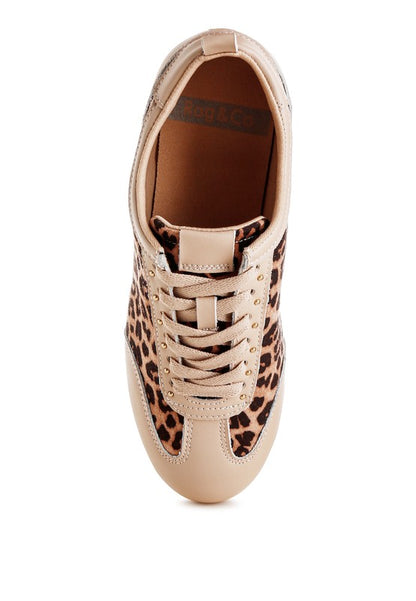 Top view of leopard print and beige genuine leather sneakers showing lace-up closure and cushioned insole.