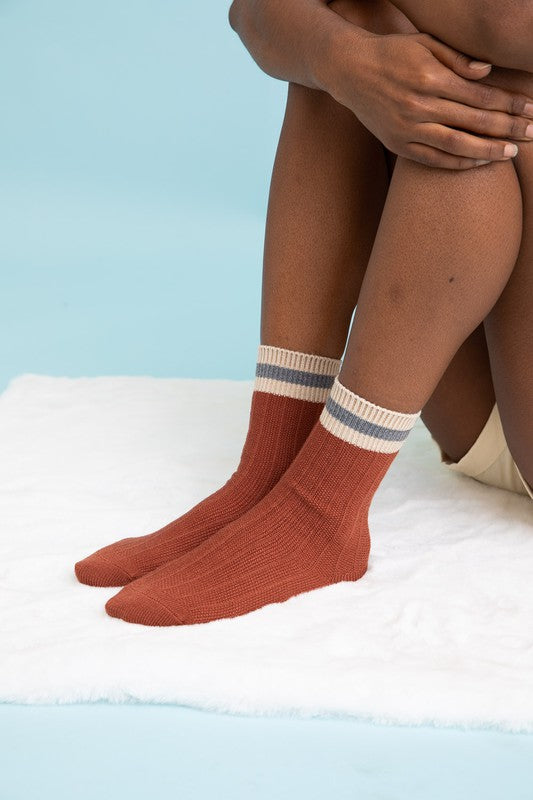 Person wearing rust Simone Color Block Socks.