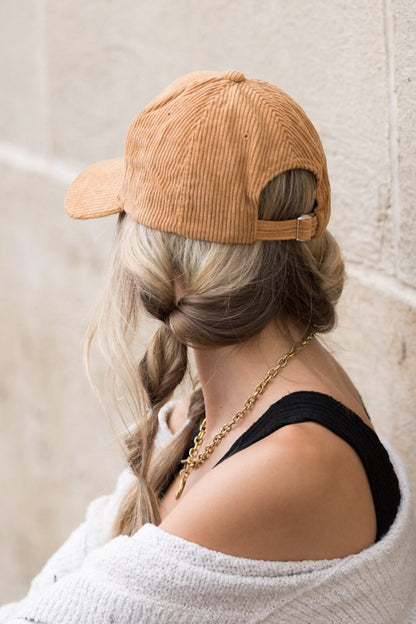 Back view of woman wearing Lindy Corduroy Boyfriend Ball Cap in Camel, showing adjustable closure and corduroy texture