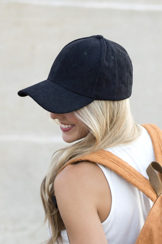 Woman wearing Lindy Corduroy Boyfriend Ball Cap in Beige, relaxed fit with textured corduroy finish