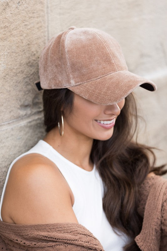 Model side view: Woman wearing taupe velour ball cap, fall-ready textured finish, side profile view.