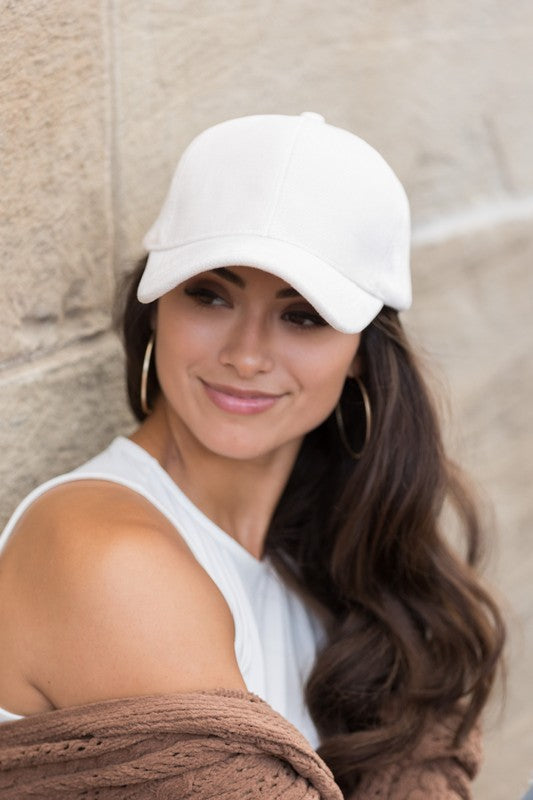 Cream velour ball cap front angle with structured crown and soft velour finish.