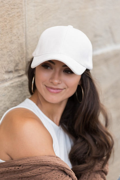 Cream velour ball cap front angle with structured crown and soft velour finish.