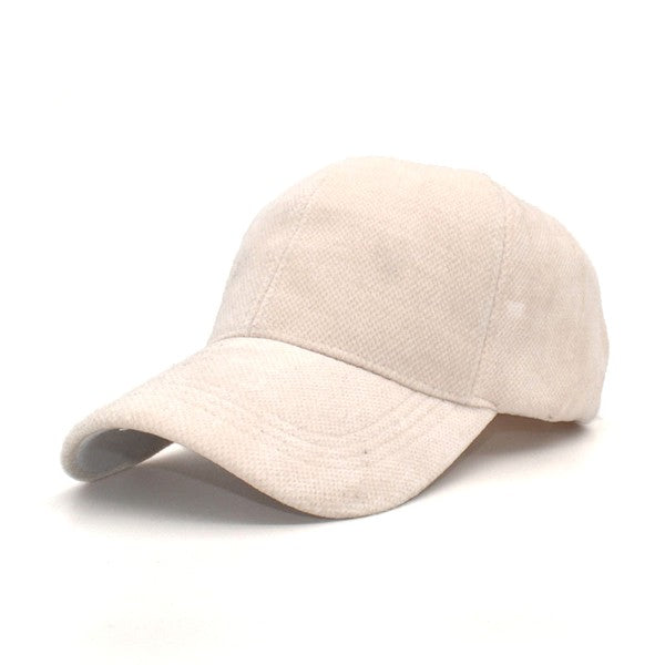 Cream velour ball cap close up highlighting velour finish and curved brim